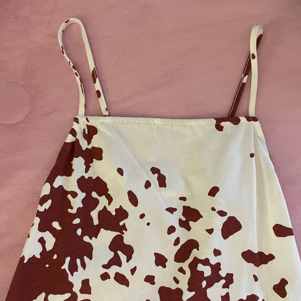 flared out brown and white cow print dress.